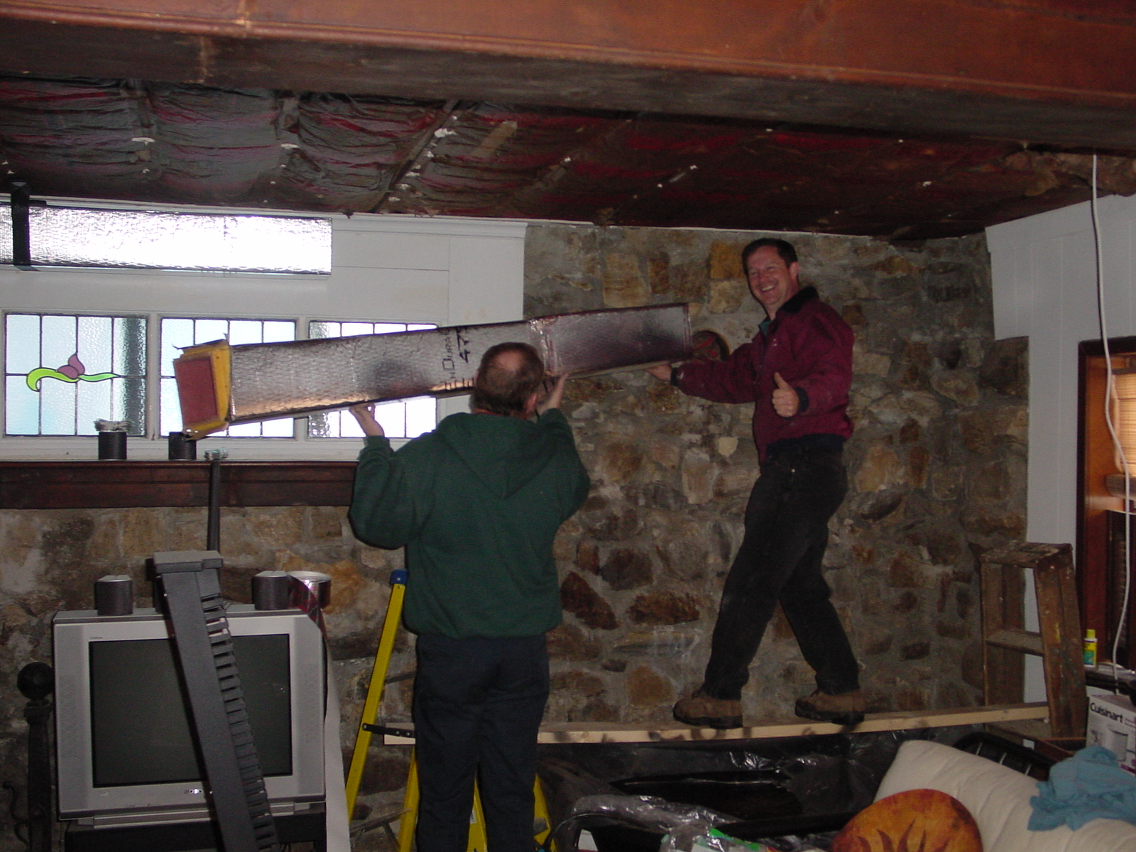 Bernie installing Unico vents in family room