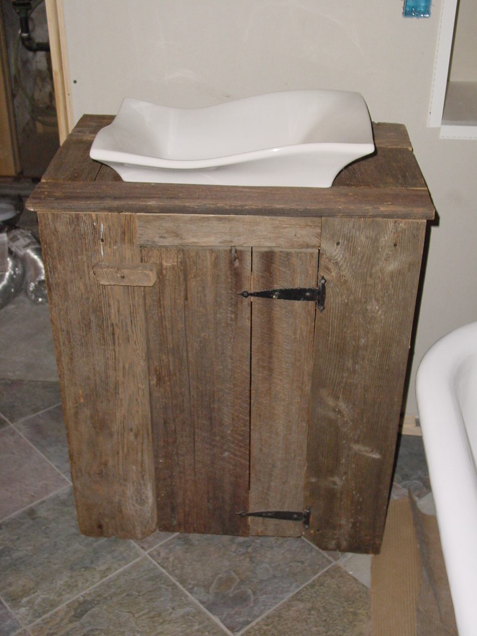 Lower bathroom vanity built from old barn wood